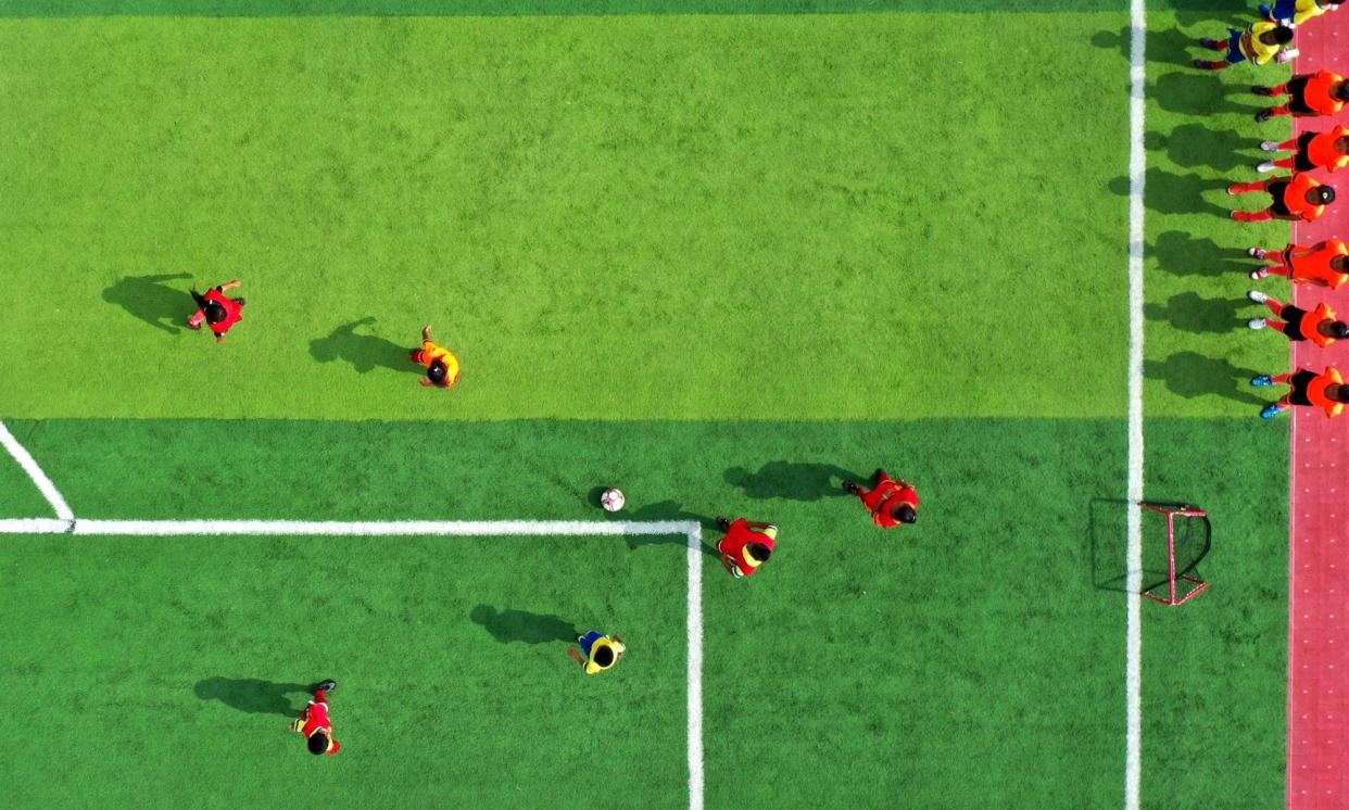 <span>A drone’s eye view of some other football that looks a bit like a screengrab of Kick Off 2.</span><span>Photograph: Xinhua/Shutterstock</span>