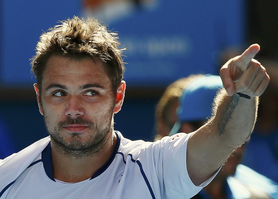 Stan Wawrinka of Switzerland celebrates defeating Kei Nishikori of Japan to win their men's singles quarter-final match at the Australian Open 2015 tennis tournament in Melbourne January 28, 2015. REUTERS/Issei Kato (AUSTRALIA - Tags: SPORT TENNIS)