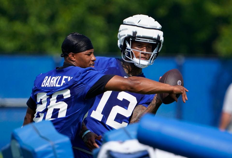 New York Giants running back Saquon Barkley (26) and tight end Darren Waller (12) on the first day of training camp in East Rutherford on Wednesday, July 26, 2023.