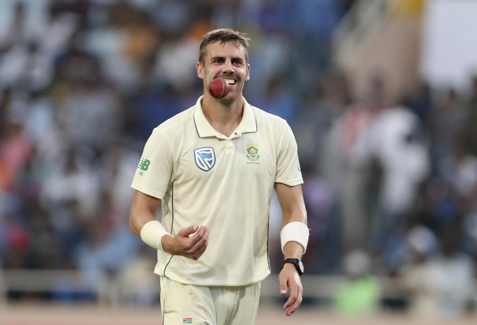 South Africa's Anrich Nortje smiles as he tosses the ball before bowling his next delivery during first day of the third and last cricket test match between India and South Africa in Ranchi, India, Saturday, Oct. 19, 2019. (AP Photo/Aijaz Rahi)