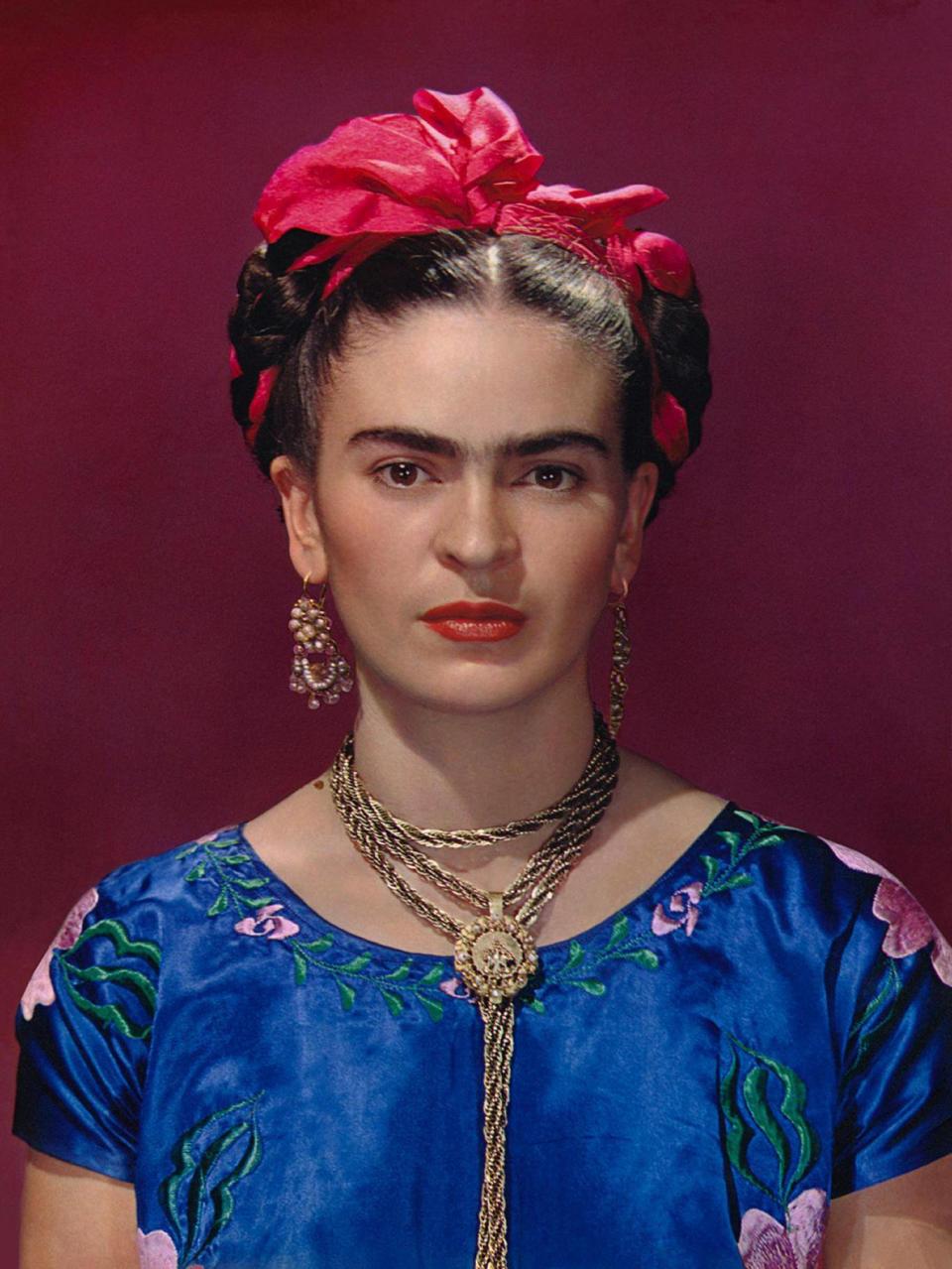 Frida Kahlo in blue satin blouse, 1939, photograph by Nickolas Muray (Nickolas Muray Photo Archives)