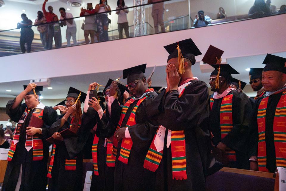 Simmons College of Kentucky graduates move their tassels during their graduation ceremoney on Sunday, May 12, 2024.