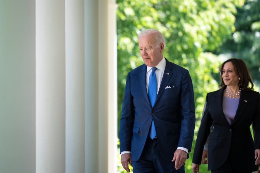 U.S. President Joe Biden and Vice President Kamala Harris walk to the Rose Garden for an event on high-speed internet access for low-income Americans, at the White House May 9, 2022, in Washington, DC. (Photo by Drew Angerer/Getty Images)