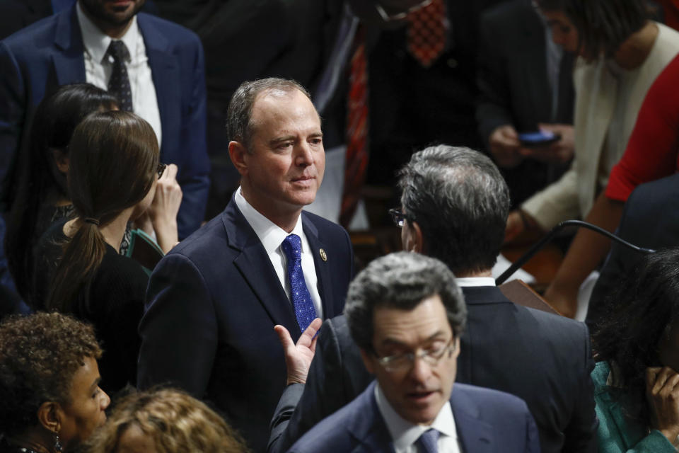 Rep. Adam Schiff, D-Calif., Chairman of the House Intelligence Committee speaks with members on the floor during a vote on the articles of impeachment against President Donald Trump, Wednesday, Dec. 18, 2019, on Capitol Hill in Washington. (AP Photo/Patrick Semansky)