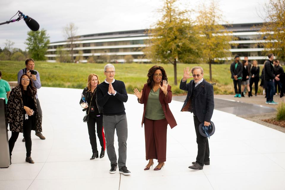 Apple CEO Tim Cook (L), Oprah Winfrey (C) and director Steven Spielberg stand for a photo during an event launching Apple tv+ at Apple headquarters on March 25, 2019, in Cupertino, California. (Photo by NOAH BERGER / AFP)        (Photo credit should read NOAH BERGER/AFP/Getty Images)