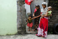 Razia Bibi (L) and her daughter-in-law Sajida Begum (R) whose names are excluded from the draft list of the National Register of Citizens (NRC), leave their house, in Dhubri district, in the northeastern state of Assam, India August 3, 2018. REUTERS/Adnan Abidi