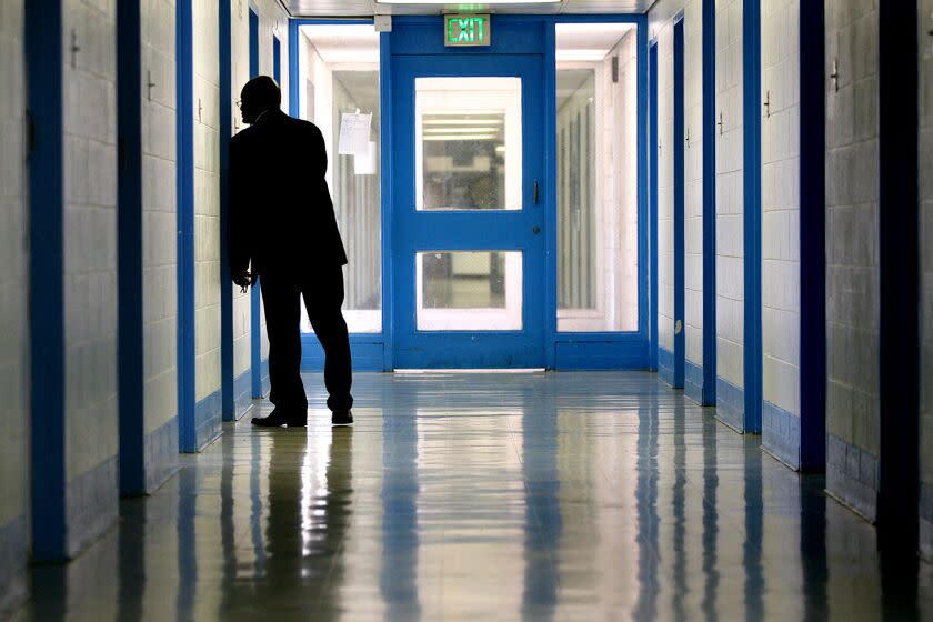 LOS ANGELES-CA-JULY 23, 2014: Superintendent Gregory McCovey peers inside a room at Central Juvenile Hall in Los Angeles on Wednesday, July 23, 2014. (Christina House / For The Times)