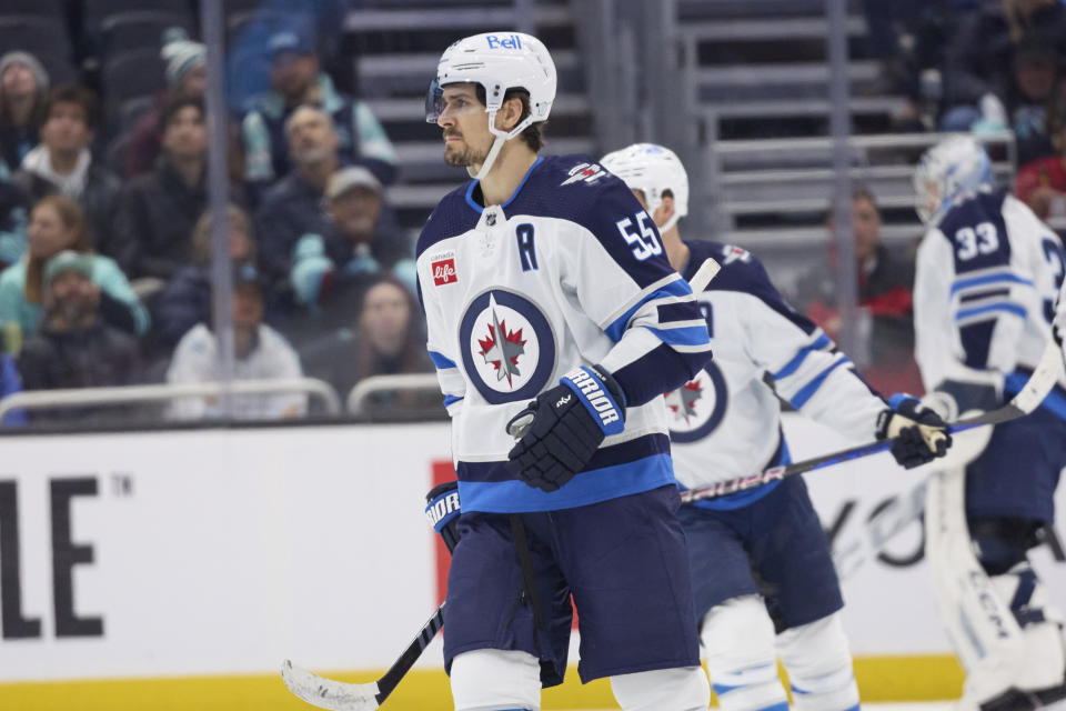 Winnipeg Jets center Mark Scheifele (55) skates to the bench after scoring against the Seattle Kraken during the first period of an NHL hockey game, Sunday, Dec. 18, 2022, in Seattle. (AP Photo/John Froschauer)