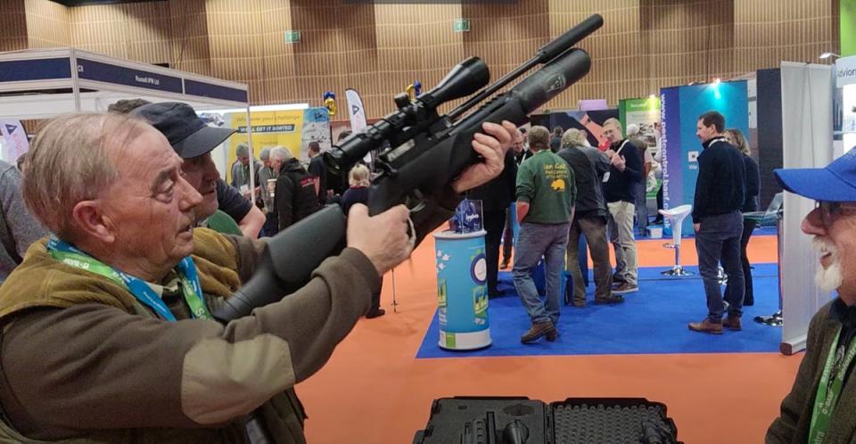 David Mills allows his prototype air rifle to be tested by a potential buyer hoping to tackle other types of pests (Barney Davis)