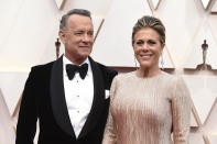 FILE - In this Feb. 9, 2020 file photo, Tom Hanks, left, and Rita Wilson arrive at the Oscars at the Dolby Theatre in Los Angeles. The couple have tested positive for the coronavirus, the actor said in a statement Wednesday, March 11. The 63-year-old actor said they will be "tested, observed and isolated for as long as public health and safety requires." (Photo by Jordan Strauss/Invision/AP, File)