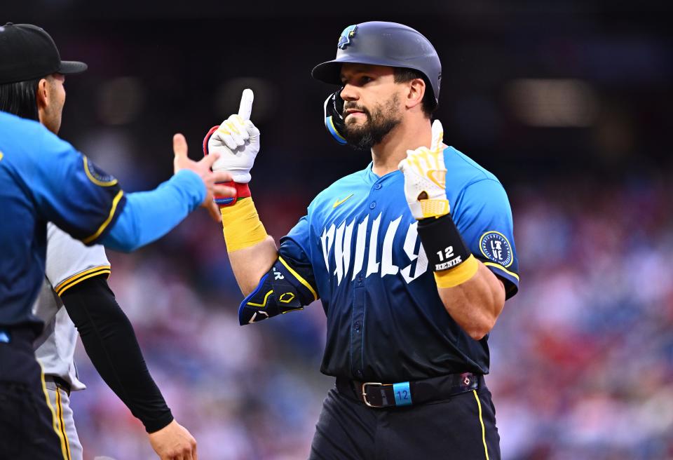 Philadelphia Phillies designated hitter Kyle Schwarber (12) reacts after hitting a single against the Pittsburgh Pirates in the first inning at Citizens Bank Park on April 12, 2024.