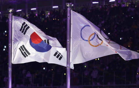 Pyeongchang 2018 Winter Olympics – Opening ceremony – Pyeongchang Olympic Stadium - Pyeongchang, South Korea – February 9, 2018 - South Korea's and Olympic flags flutter during the opening ceremony. REUTERS/Kim Kyung-Hoon