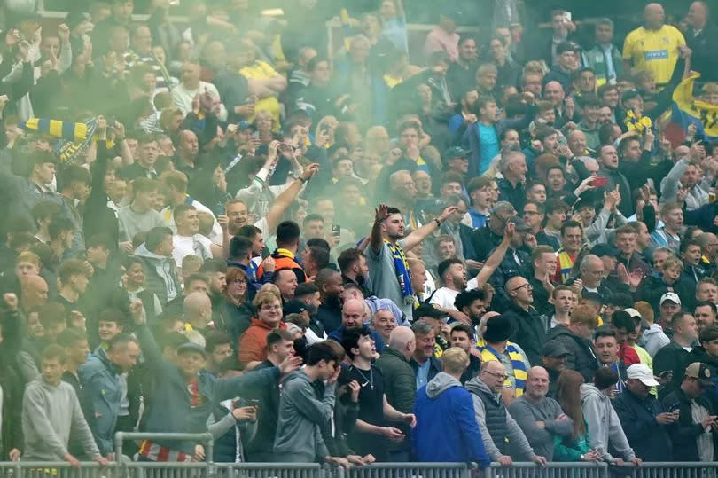 Solihull Moors fans celebrate their side scoring the opening goal during the Vanarama National League play off final match at the London Stadium, London