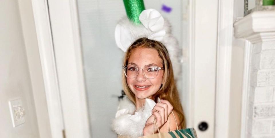 tween girl wearing homemade starbucks cup costume for halloween