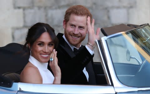 The newly married Duke and Duchess of Sussex, Meghan Markle and Prince Harry, leaving Windsor Castle after their wedding - Credit: Steve Parsons/PA