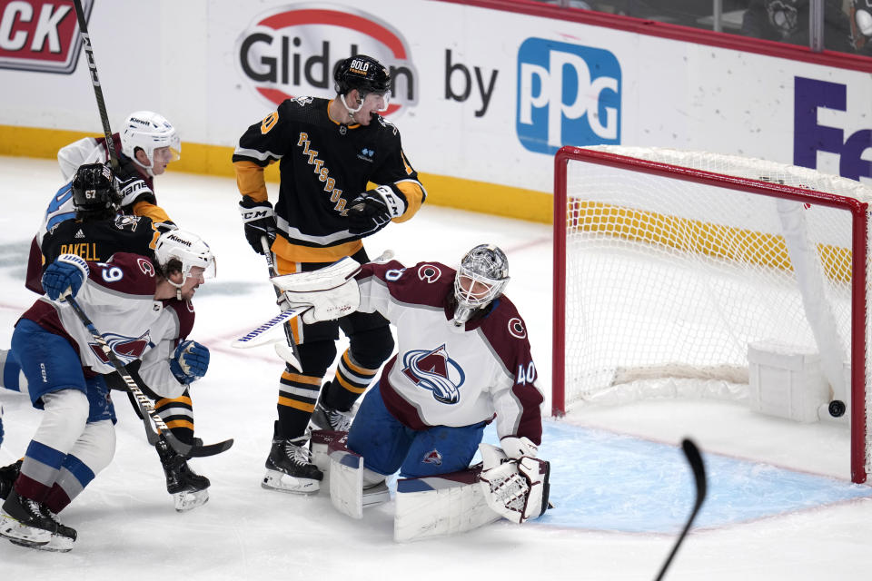 A shot by Pittsburgh Penguins' Reilly Smith, not seen, gets past Colorado Avalanche goaltender Alexandar Georgiev (40) for a goal during the first period of an NHL hockey game in Pittsburgh, Thursday, Oct. 26, 2023. It was the first of two goals in the period for Smith. (AP Photo/Gene J. Puskar)