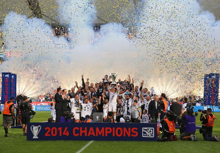 L.A. Galaxy players hold the Philip F. Anschutz Trophy after defeating the New England Revolution in their MLS Cup final in Los Angeles, California, on December 7, 2014