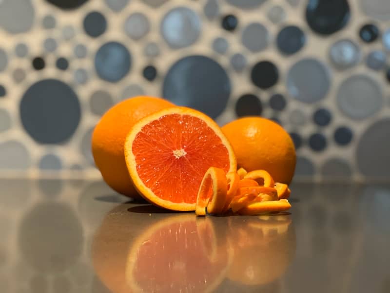 Citrus cut in half on kitchen counter.