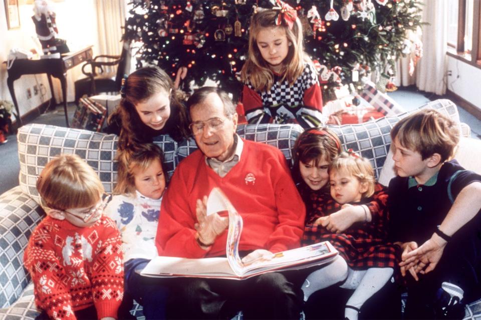 George H.W. Bush reads to his grandchildren, November 1991.