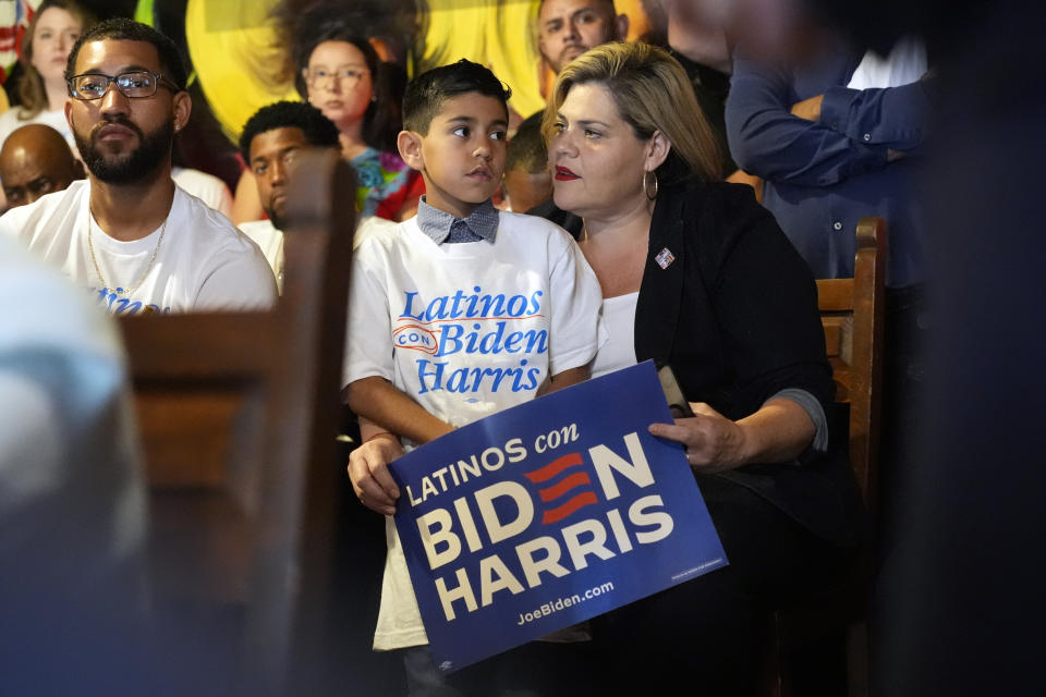 People listen as President Joe Biden speaks at a campaign event at El Portal restaurant Tuesday, March 19, 2024, in Phoenix. (AP Photo/Jacquelyn Martin)