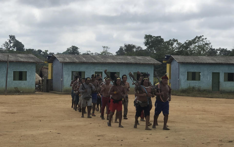 Indigenous Xikrin warriors return from a failed attempt to expel land squatters from the Trincheira Bacaja Indigenous Indigenous territory, in Brazilian Amazon, Para state, Brazil, Aug. 24, 2019. Brazil's government on Monday, Oct. 2, 2023, began removing non-indigenous people from two Indigenous territories in a move that will affect thousands living in the Amazon rainforest's heart. (AP Photo/Fabiano Maisonnave)