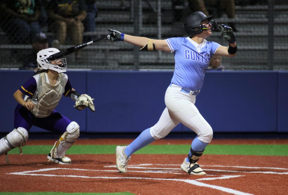 Gunter's Rhyan Pogue hits a two-run homer and also threw a three-hitter with 10 strikeouts as the Lady Tigers started their bi-district series with a win over Edgewood.