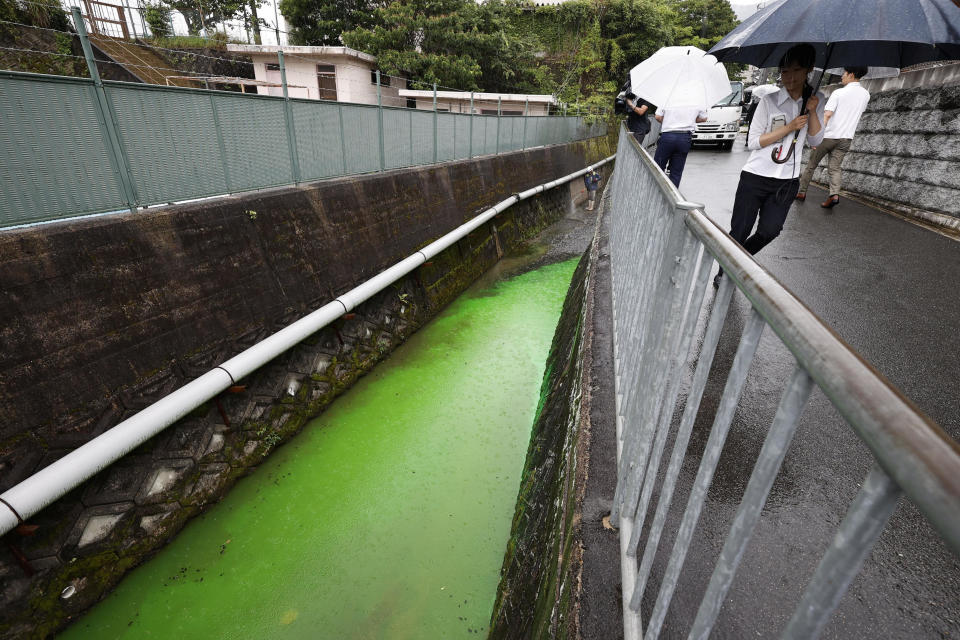 The Tatsuta River, discolored to bright green, is seen in Ikoma, Nara prefecture, western Japan  July 5, 2023, in this photo taken by Kyodo.  / Credit: Kyodo via REUTERS