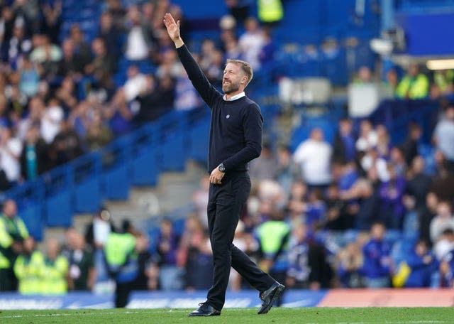 Chelsea manager Graham Potter gestures to the fans 