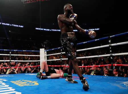 Boxing - Deontay Wilder v Tyson Fury - WBC World Heavyweight Title - Staples Centre, Los Angeles, United States - December 1, 2018 Deontay Wilder reacts after knocking down Tyson Fury Action Images via Reuters/Andrew Couldridge