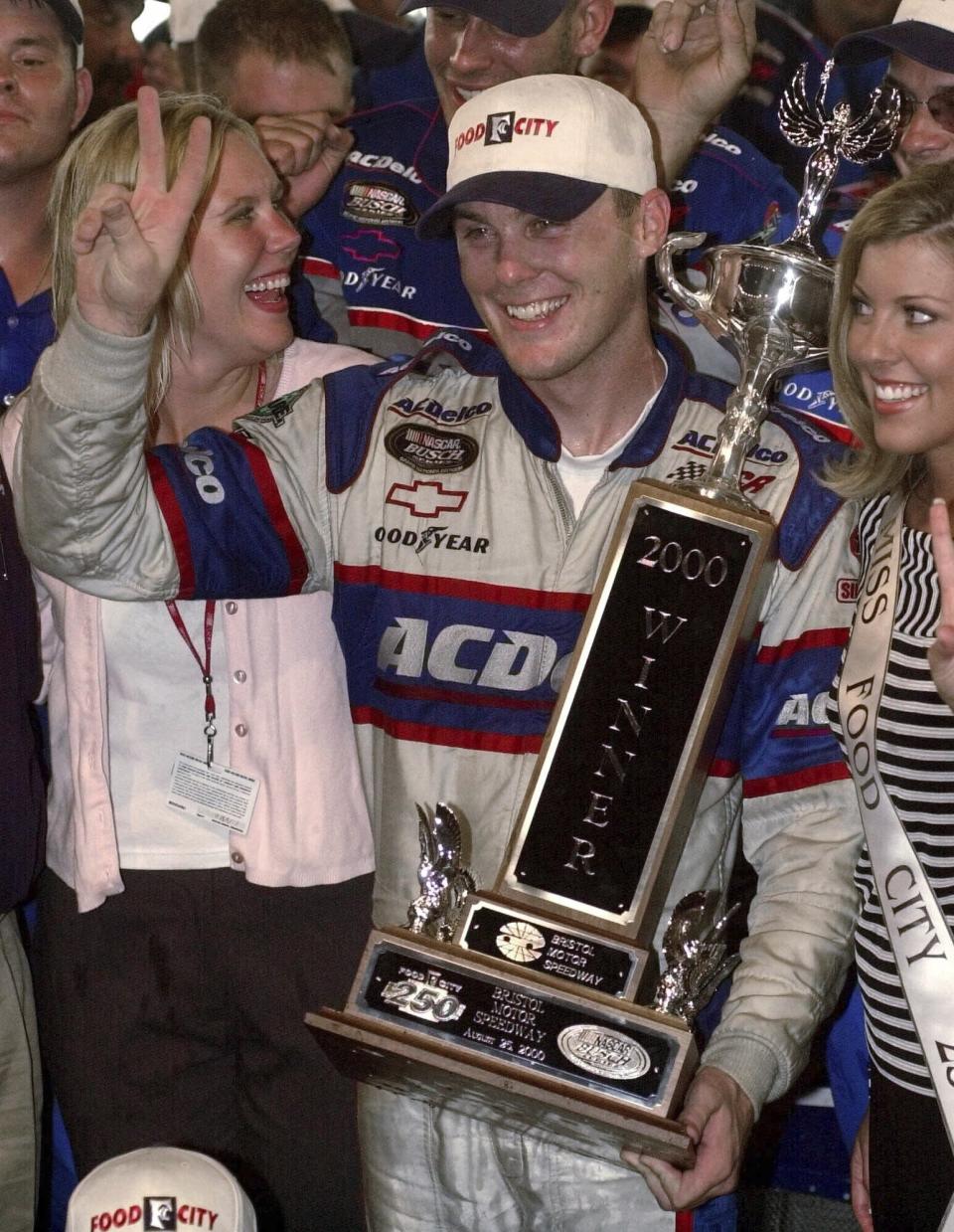 FILE - Kevin Harvick celebrates in victory lane after winning the NASCAR Food City 250 in Bristol, Tenn., Friday, Aug. 25, 2000. Kevin Harvick said Thursday, Jan. 12, 2023, he will retire from NASCAR competition at the end of the 2023 season. (AP Photo/Mark Humphrey, File)