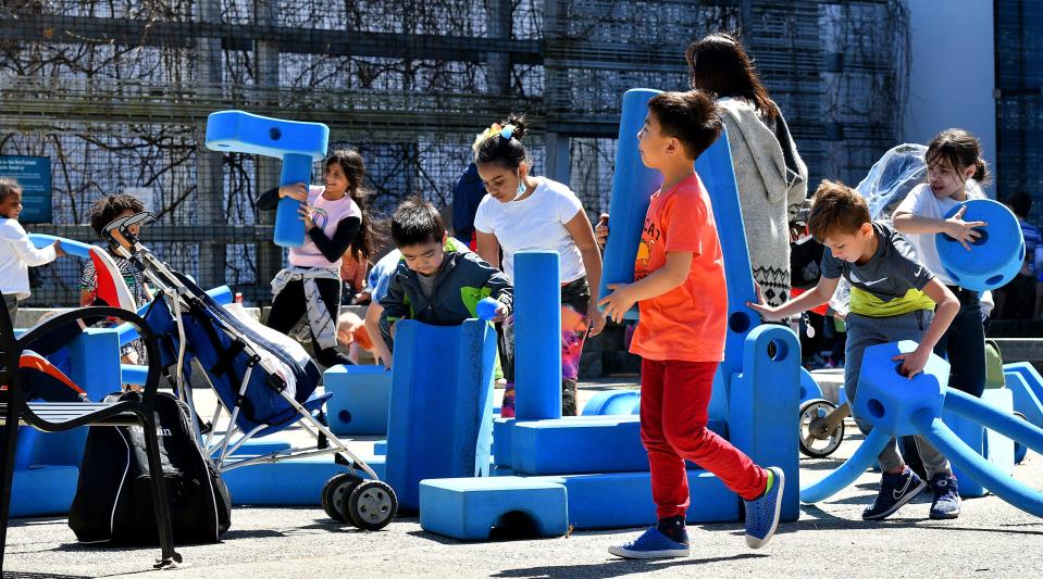 Children play with foam blocks as part of the Imagination playground during previous Earth Day activities at the EcoTarium.