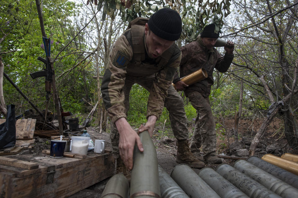 Ukrainian soldiers prepare self-propelled howitzer shells in Chasiv Yar, the site of heavy battles with the Russian forces in the Donetsk region, Ukraine, Thursday, May 11, 2023. (Iryna Rybakova via AP)