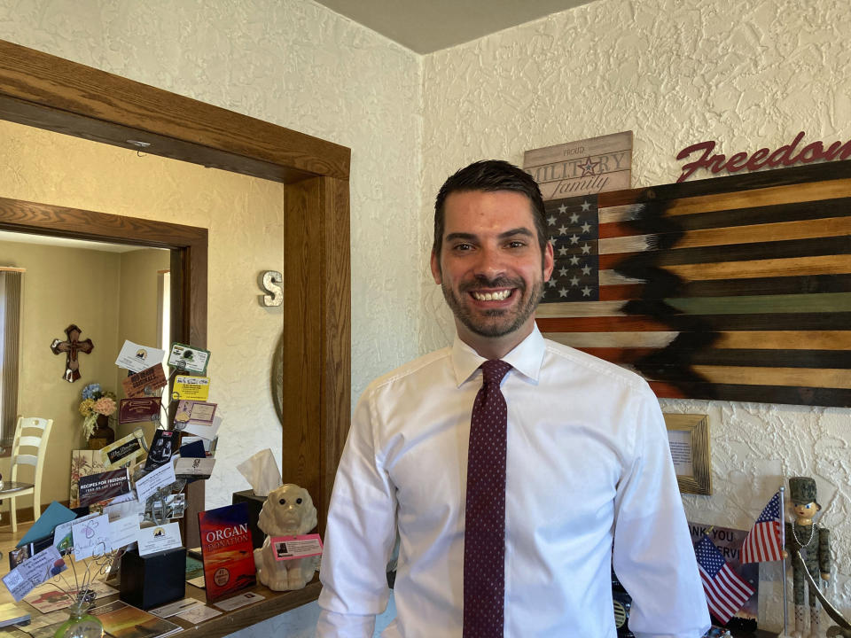 Wisconsin GOP attorney general hopeful Eric Toney poses at the Stone Oak Coffee Haus in Fond du Lac, Wis., on Wednesday, Aug. 31, 2022. Toney won’t commit to voting for Donald Trump in 2024 should he run for president again, staking a position that puts him at odds with other top Republicans on the ballot in the battleground state this November.(AP Photo/Todd Richmond)