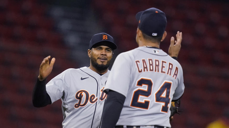 Detroit Tigers third baseman Jeimer Candelario, left, is congratulated by Miguel Cabrera (24) after the Tigers defeated the Boston Red Sox 6-5 in a baseball game at Fenway Park, Wednesday, May 5, 2021, in Boston. Candelario hit a three-run home run in the 10th inning. (AP Photo/Charles Krupa)