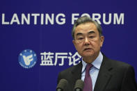 Chinese Foreign Minister Wang Yi delivers his opening remarks at the Lanting Forum on bringing China-U.S. relations back to the right track, at the Ministry of Foreign Affairs office in Beijing on Monday, Feb. 22, 2021. Wang called on the U.S. Monday to lift restrictions on trade and people-to-people contacts while ceasing what Beijing considers unwarranted interference in the areas of Taiwan, Hong Kong, Xinjiang and Tibet. (AP Photo/Andy Wong)
