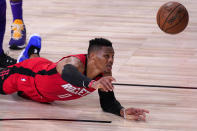 Houston Rockets' Russell Westbrook reaches for a loose ball against the Los Angeles Lakers during the second half of an NBA conference semifinal playoff basketball game Thursday, Sept. 10, 2020, in Lake Buena Vista, Fla. (AP Photo/Mark J. Terrill)