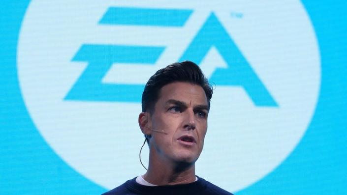 EA CEO Andrew Wilson stands on stage at a video game showcase contemplating his next million.
