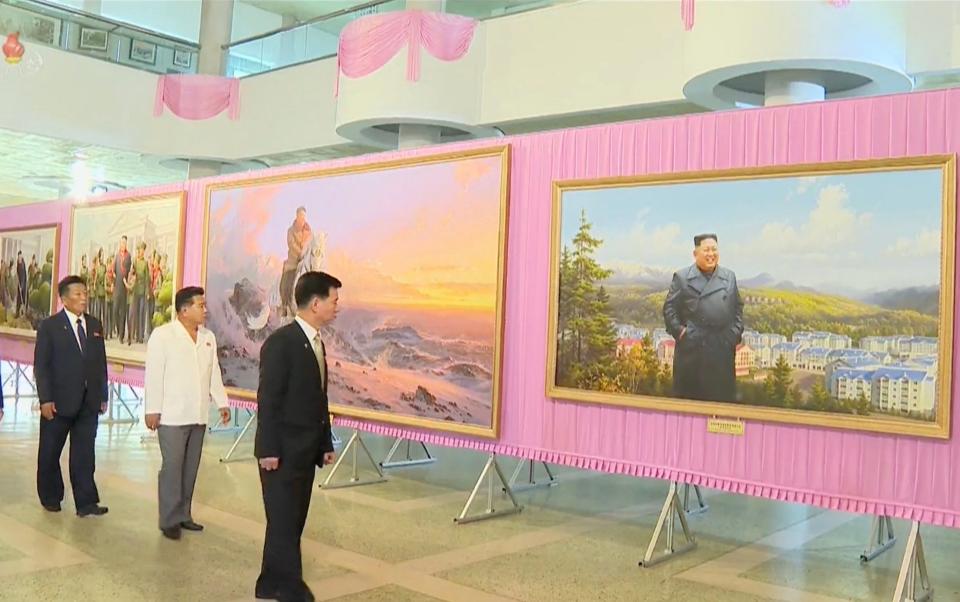 The art exhibition appears to demonstrate a shift in the propaganda policy surrounding Kim, displaying his image in a more central position than pictures of his father and grandfather