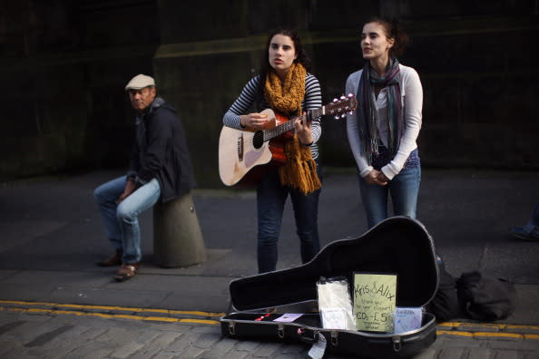 Street entertainers perform on the Royal Mile during the Edinburgh Fringe Festival on August 6, 2012 in Edinburgh, Scotland. The Edinburgh Festival Fringe is the largest arts festivals in the world, it was established as an alternative to the International Festival also held in August, and celebrates it's 66th anniversary this year. (Photo by Dan Kitwood/Getty Images)