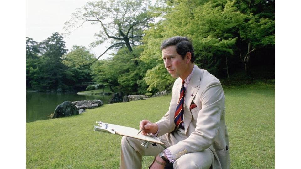 Charles sketching in garden 