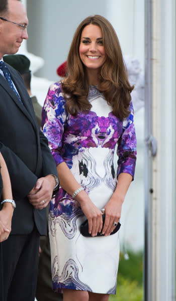 Later in the evening, Kate decided to be a bit more daring by changing into a bright purple Prabal Gurung dress for the state dinner at Singapore's Istana. It's not Kate's typical look which is why it's so exciting to see her in a dress that is so different from her usual monochrome dresses. (Photo by Samir Hussein/WireImage)