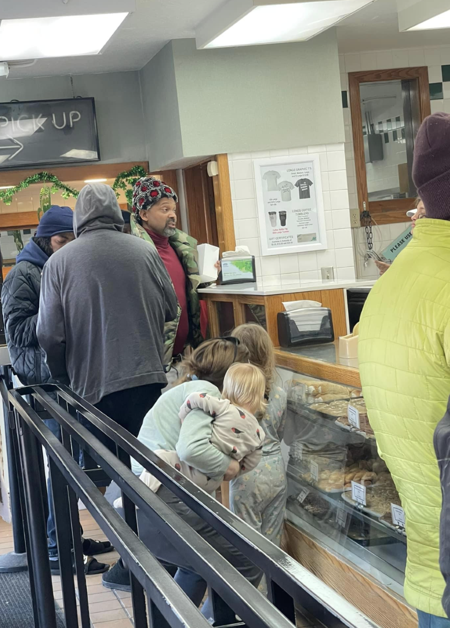 Comedian-actor Mike Epps treats customers to doughnuts at Long's Bakery, 1453 N. Tremont St., Indianapolis, on March 4, 2023.