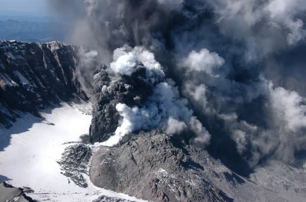 Mount St. Helens spews steam and gray ash from a small explosive eruption in its crater on October 1, 2004.<br><em>(John Pallister / USGS / Reuters)</em>