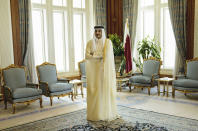 <p>Qatar Emir Sheik Tamim bin Hamad Al-Thani waits for the arrival of U.S. Secretary of State John Kerry ahead of their meeting, at Diwan Palace in Doha, Qatar on Aug. 3, 2015. Four Arab nations have cut ties with Qatar over an escalating diplomatic battle over the country’s backing of Islamist groups and its relations with Iran. (Photo: Brendan Smialowski/Pool Photo via AP) </p>