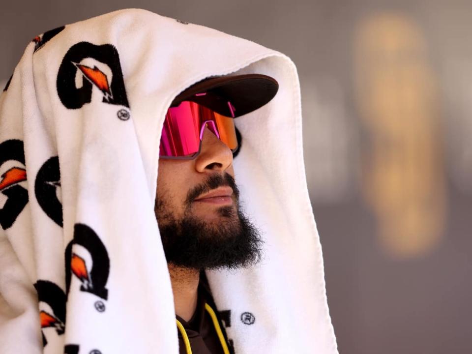 San Diego Padres shortstop Fernando Tatis Jr. looks on from the dugout during a game in May. Tatis Jr. was suspended 80 games by MLB last week after testing positive for the performance-enhancing substance Clostebol. (Sean M. Haffey/Getty Images - image credit)