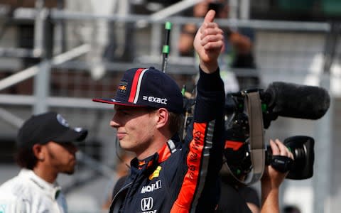 Red Bull driver Max Verstappen of the Netherland's, center, gives the thumbs up after taking his first career pole position for the Hungarian Formula One Grand Prix after qualification at the Hungaroring racetrack in Mogyorod, northeast of Budapest, Hungary, Saturday, Aug. 3, 2019. The Hungarian Formula One Grand Prix takes place on Sunday - Credit: AP