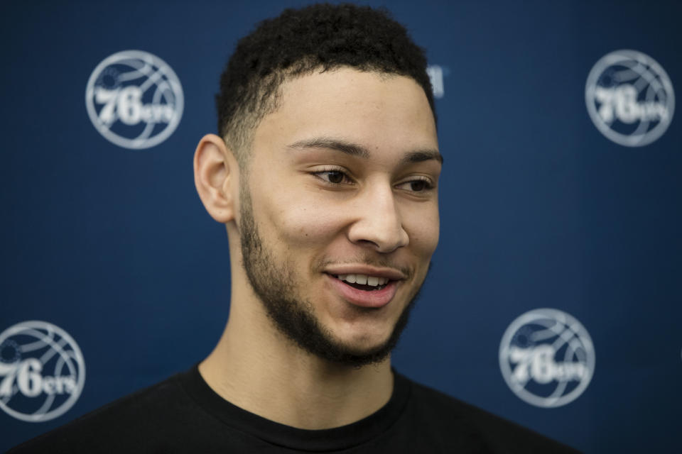 FILE - In this April 13, 2017, file photo, Philadelphia 76ers' Ben Simmons speaks with members of the media at the team's NBA basketball training facility in Camden, N.J. A person familiar with the situation says the Philadelphia 76ers and star guard Ben Simmons have agreed to a $170 million, five-year contract extension. The max deal is the latest big commitment by the team. The person spoke to The Associated Press on condition of anonymity Monday, July 15, 2019, because the contract is not official. (AP Photo/Matt Rourke, File)