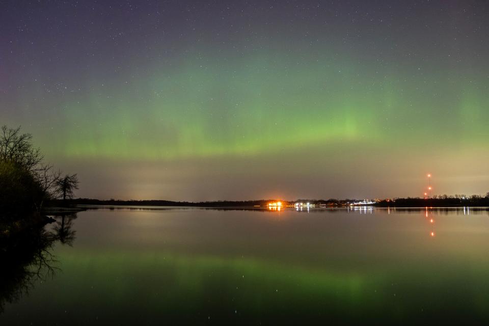 The northern lights appear above Big Creek State Park, on Sunday, April 23, 2023, outside Polk City, in central Iowa. 