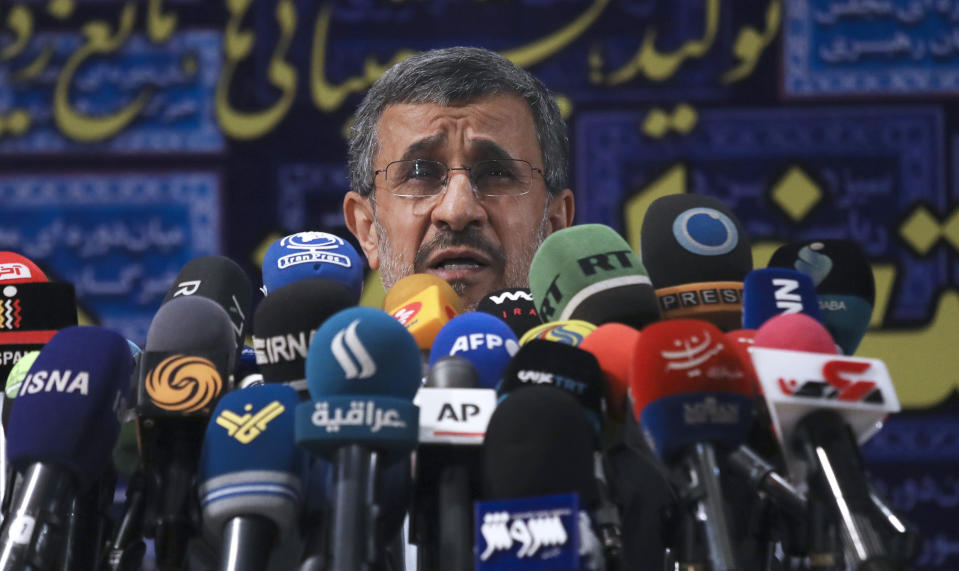 Former President Mahmoud Ahmadinejad speaks with the media after registering his name as a candidate for the June 18 presidential elections at elections headquarters of the Interior Ministry in Tehran, Iran, Wednesday, May 12, 2021. The country's former firebrand president will run again for office in upcoming elections in June. The Holocaust-denying Ahmadinejad has previously been banned from running for the presidency by Supreme Leader Ayatollah Ali Khamenei in 2017, although then, he registered anyway. (AP Photo/Vahid Salemi)