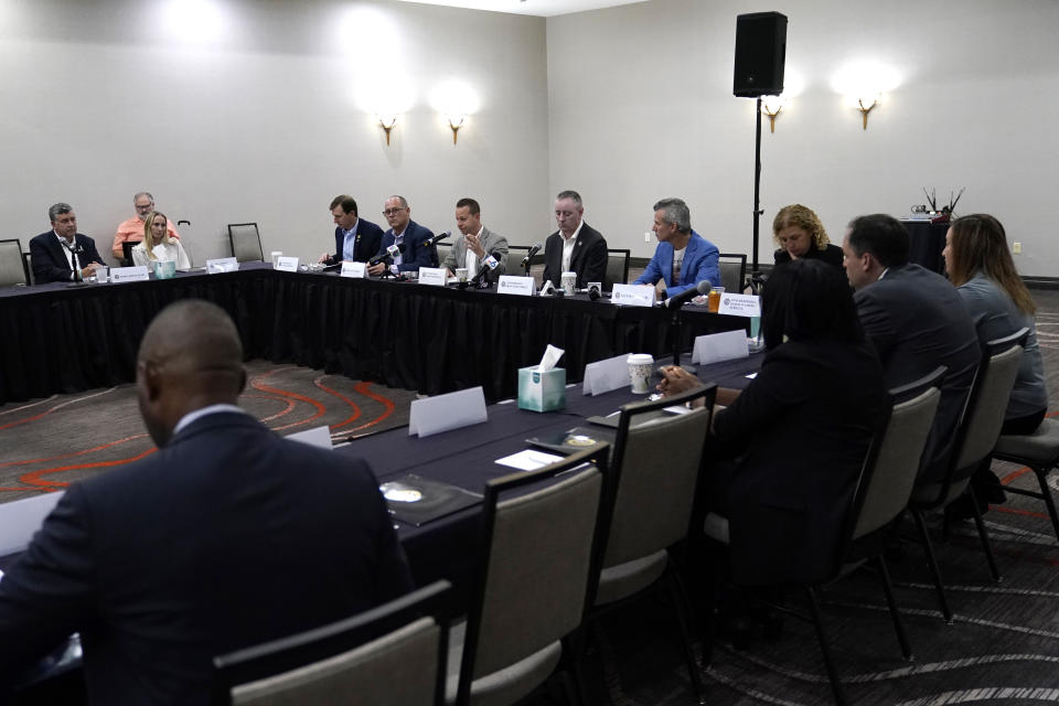 Rep. Jared Moskowitz, D-Fla., left, speaks during a school safety roundtable Monday, Nov. 20, 2023, in Coral Springs, Fla. A Congressional delegation, family members and government officials toured Marjory Stoneman Douglas High School, where fourteen students and three staff members were fatally shot in 2018. (AP Photo/Lynne Sladky)